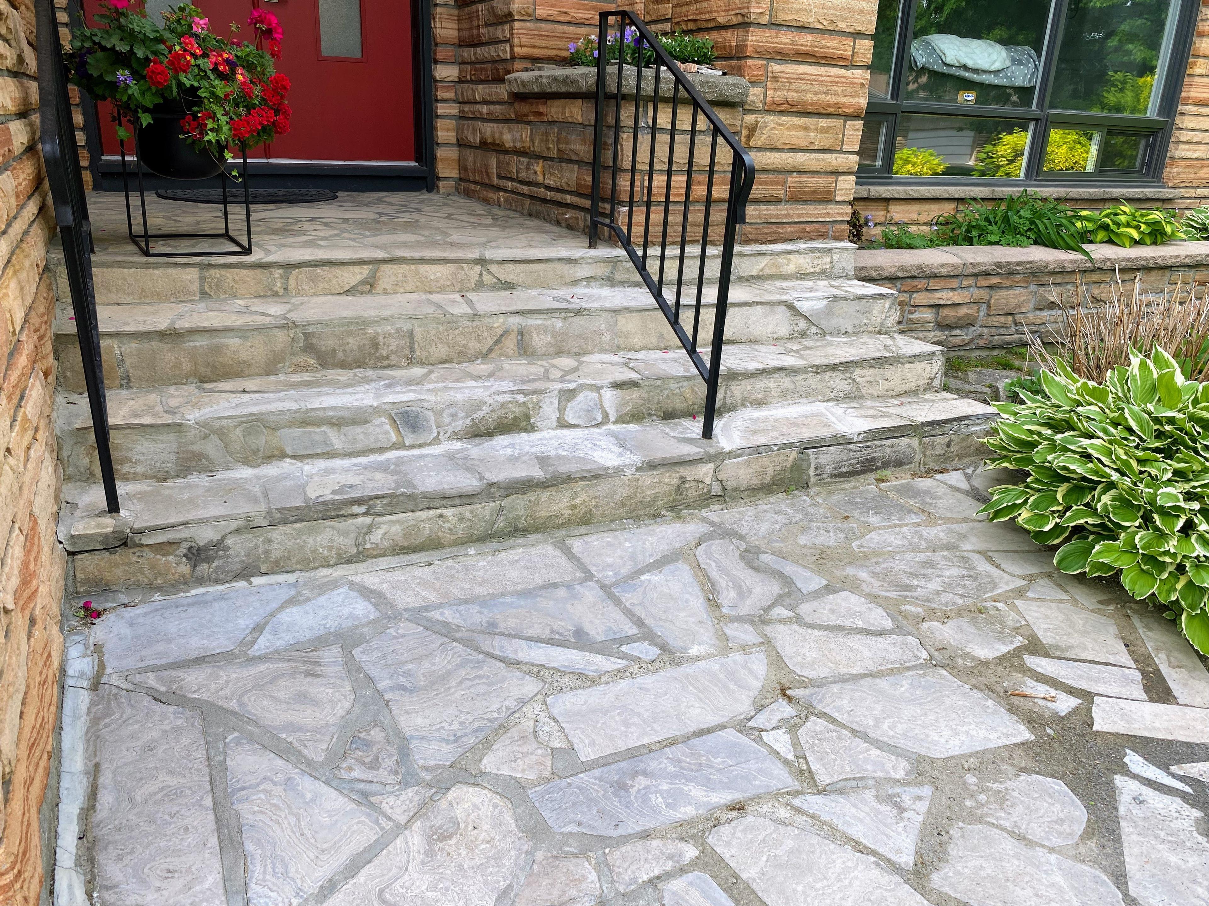 Image of a flagstone entryway steps surrounded by greenery in Alta Vista, Ottawa